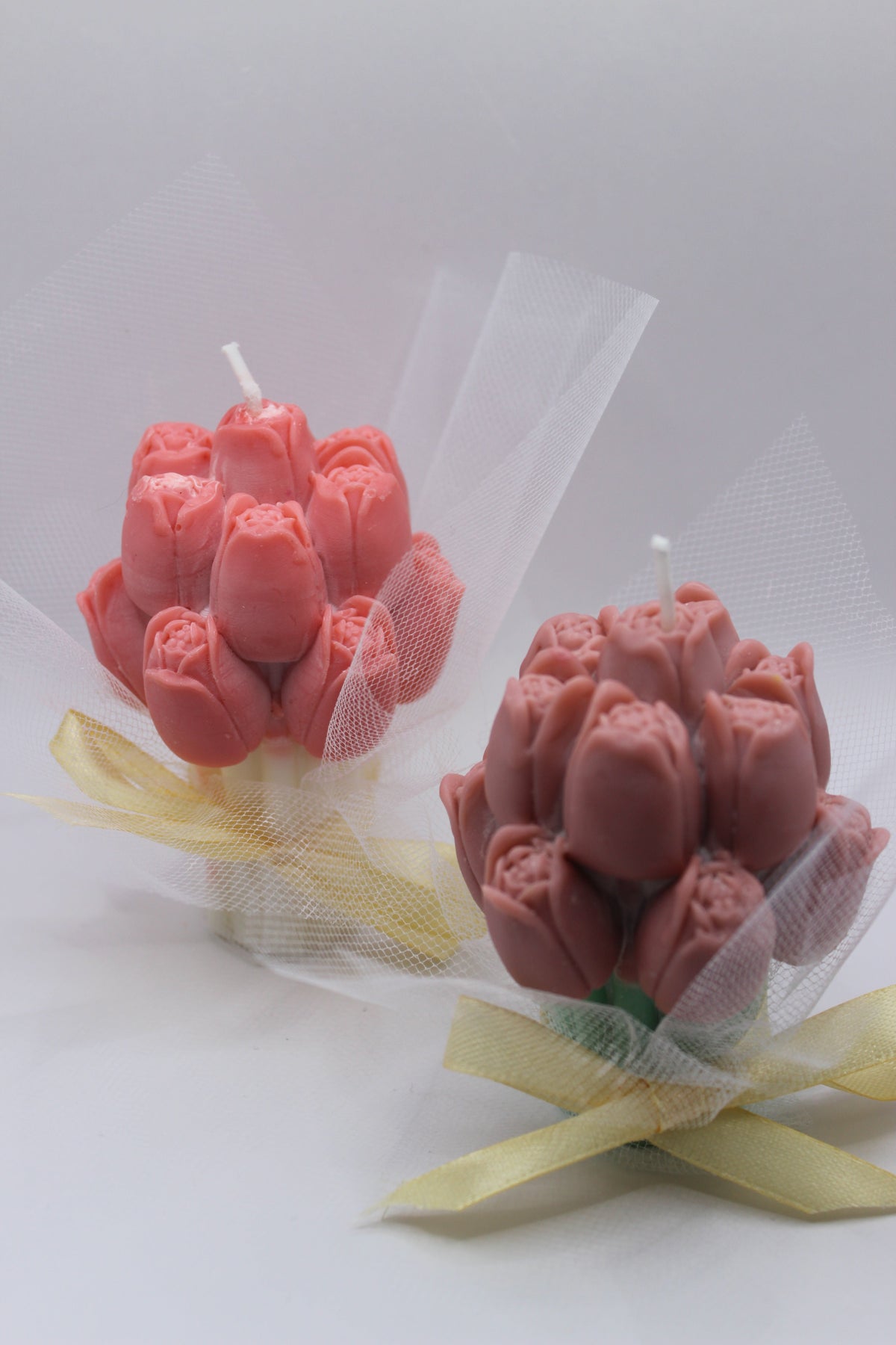 Ramo Aura — detalhe de ramos de vela aromática em tom rosa
